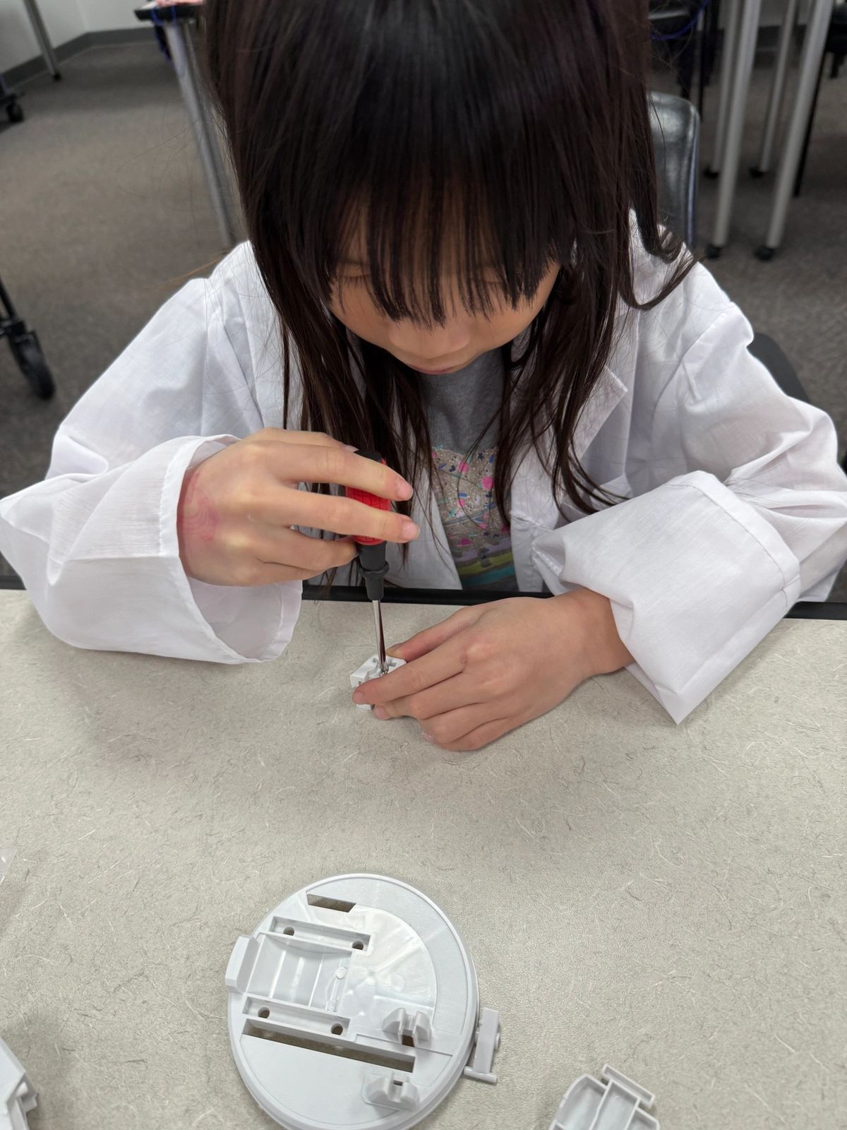 A young scientist investigating how things work